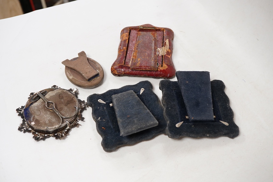 A late Victorian repousse silver mounted small photograph frame, Chester, 1898, 13.1cm, together with two other late Victorian silver mounted photograph frames, including small oval and pierced border and a pair of moder